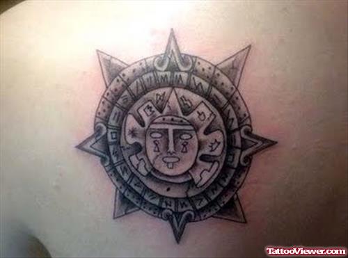 Grey Ink Aztec Sun Tattoo On Left Back Shoulder