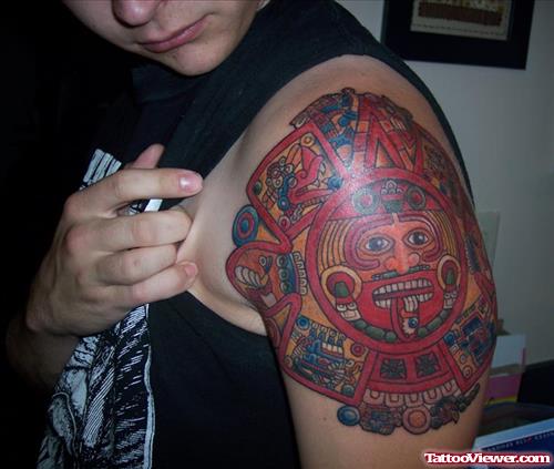 Dreadful Colored Aztec Tattoo On Left Shoulder