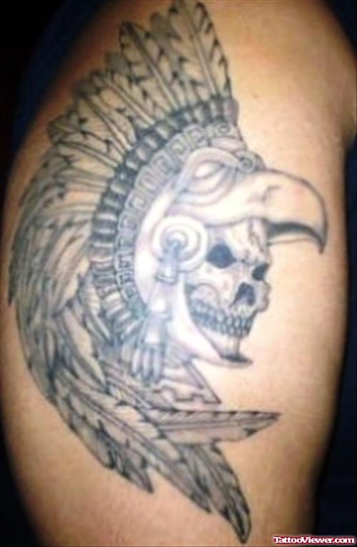 Attractive Aztec Skull With Feather Tattoo