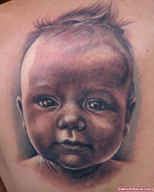 Grey Ink Baby Portrait Tattoo