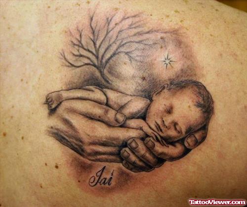 Cute Baby In Hands Tattoo On Back