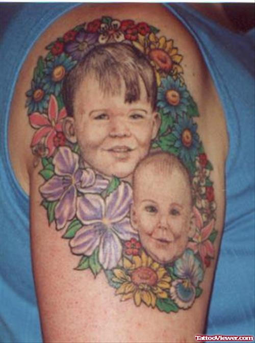 Colored flowers And Baby Heads Tattoos On Shoulder