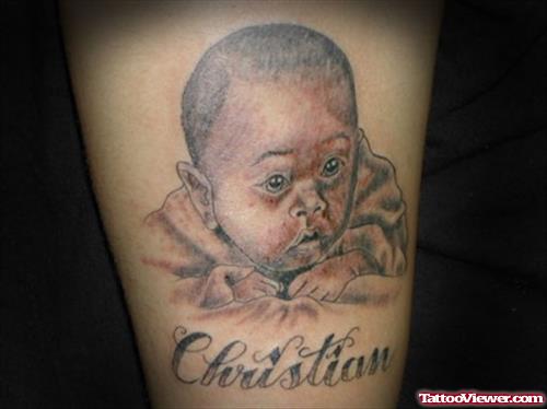 Christian Baby Portrait Tattoo On Arm