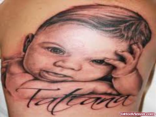 Attractive Grey ink Baby Head Tattoo