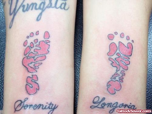 Pink Baby Footprints Tattoos On Arm
