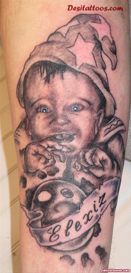 Grey Ink Banner And Baby Tattoo On Arm