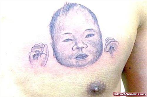 Grey Ink Baby Head Tattoo On Man Chest