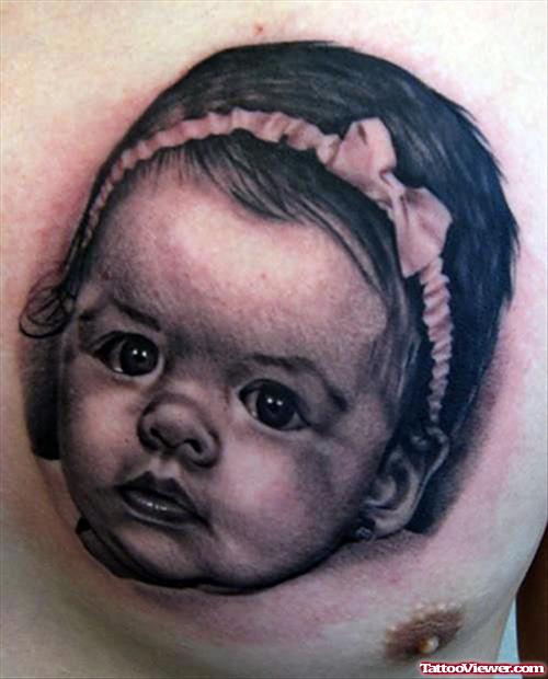 Grey Ink Baby Girl Head Tattoo On Chest