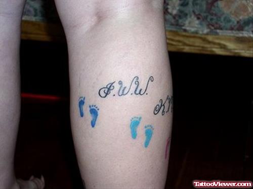 Blue Ink small Baby Footprints Tattoos On Right Leg