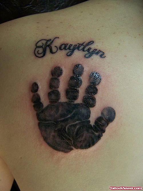 Black Ink Handprint Tattoo On Left Back Shoulder