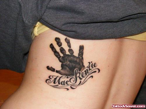 Baby Name And Hand Print Tattoo On Side