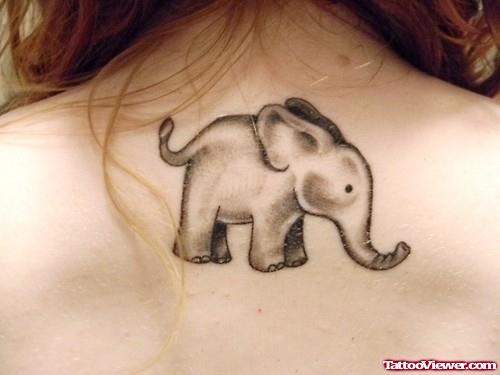Grey Ink Elephant Tattoo On Upperback