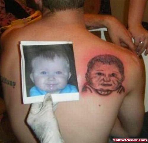Grey Ink Baby Portrait Tattoo On Right Back Shoulder