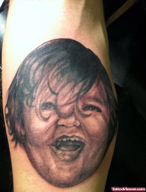 Grey Ink Baby Head Tattoo On Arm