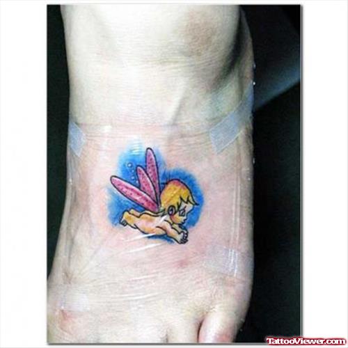 Flying Baby Angel Tattoo On Left Foot