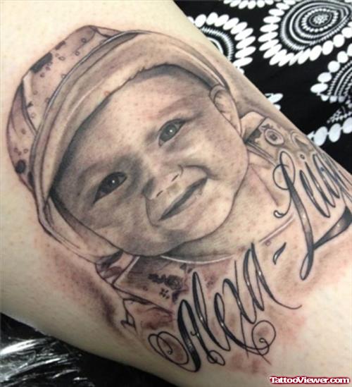 Grey Ink Baby Tattoo On Arm