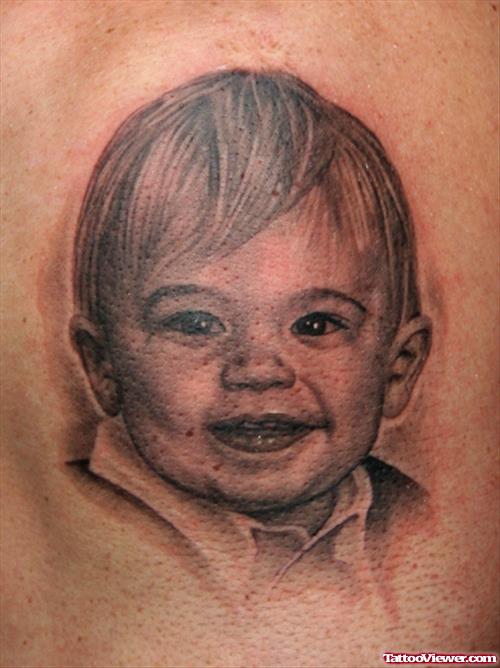 Grey Ink Cute Baby Portrait Tattoo