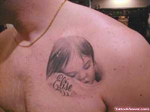 Grey Ink Baby Tattoo On Man Chest