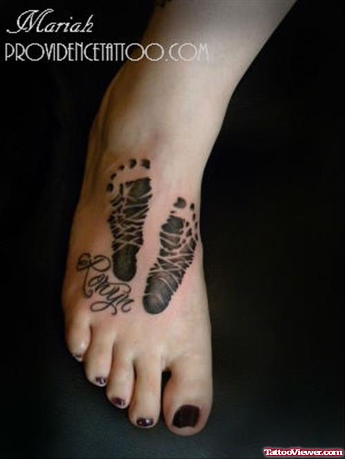 Girl Have Baby Footprints Tattoos