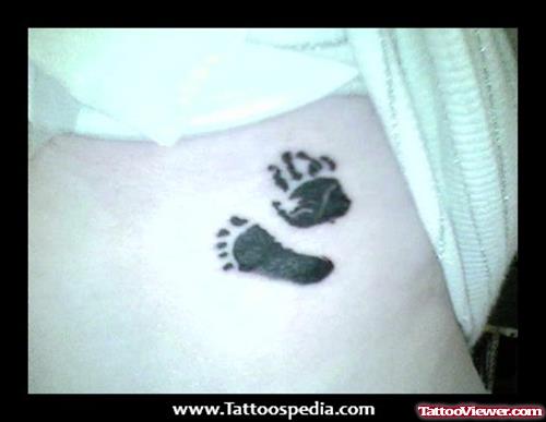 Foot Print And Hand Print Tattoo On Side