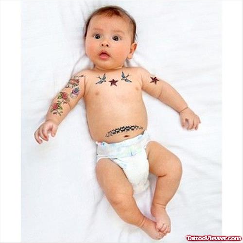 Flying Biurds And Nautical Stars Tattoo On Baby Arm And Chest