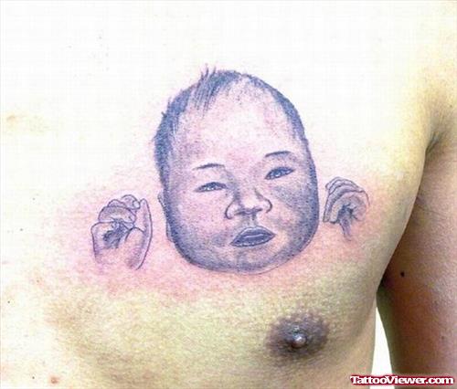 Cute Baby Head Tattoo On Man Chest