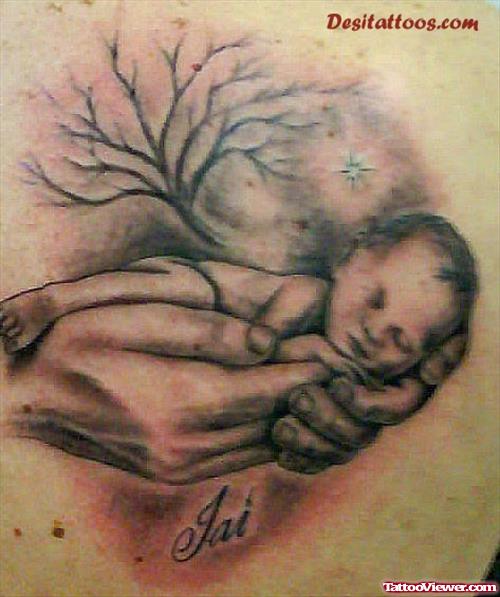 Grey Ink Baby In Hand Tattoo