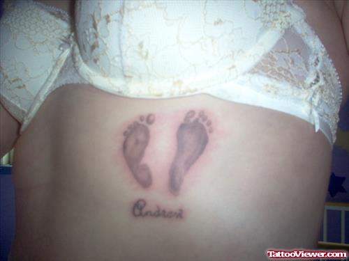 Grey Ink Baby Footprints Tattoo On Girl Side Rib