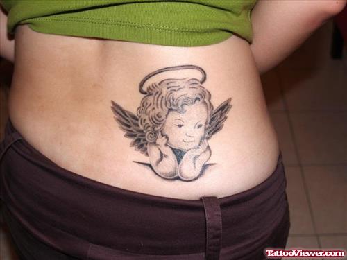 Grey Ink Baby Angel Tattoo On Lowerback