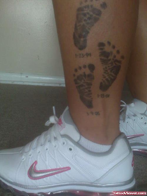 Awesome Grey Ink Baby Footprints Tattoos On Left Leg