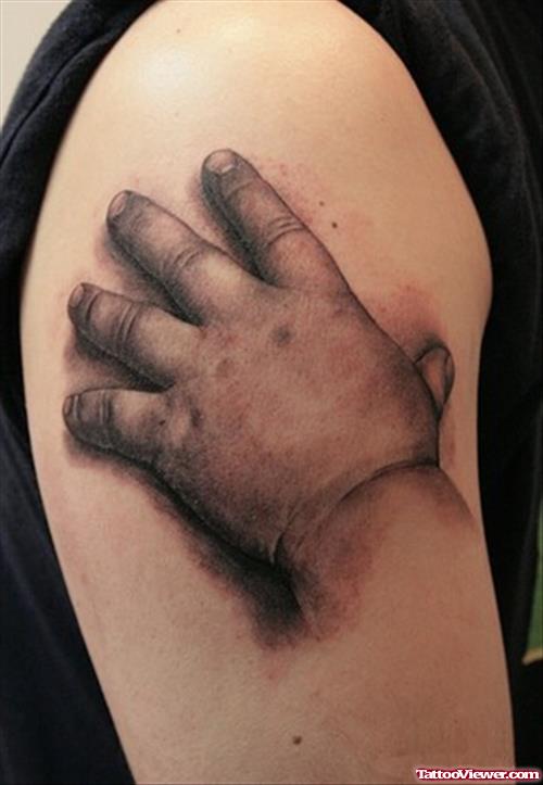 Realistic Baby Hand Tattoo On Right Half Sleeve