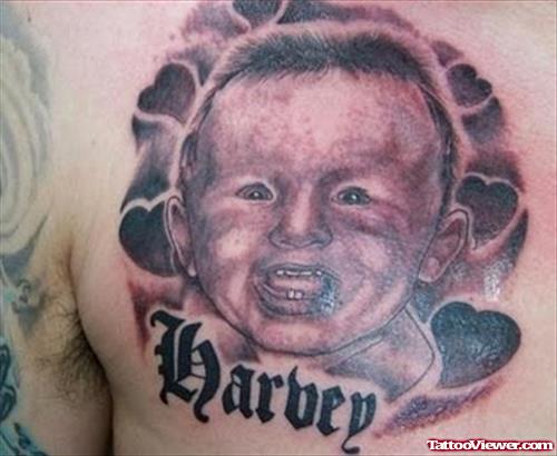 Dark Ink Baby Tattoo On Chest