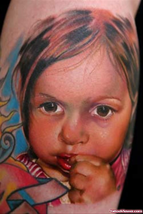 Colored Baby Portrait Tattoo On Arm