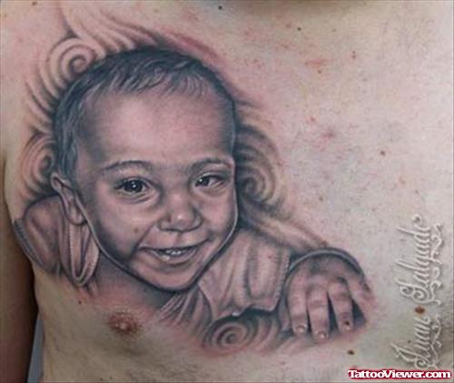 Baby Portriat Tattoo On Man Chest