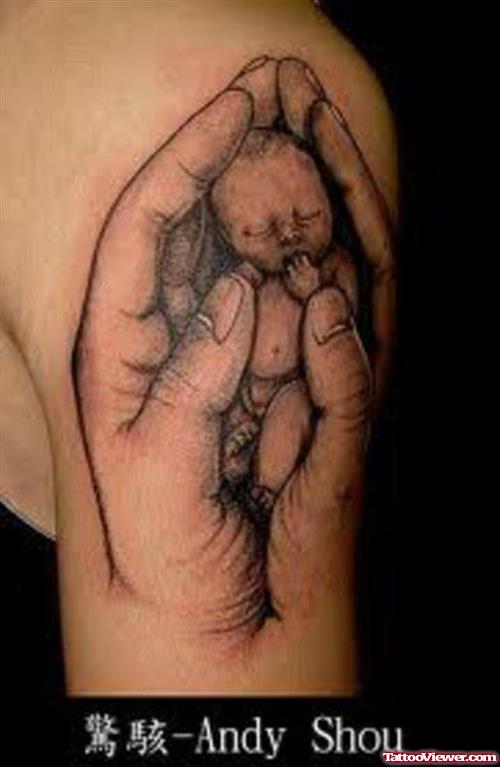 Baby In Hands Tattoo On Left Sleeve