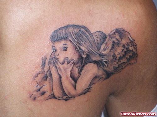 Grey Ink Baby Angel Girl Tattoo On Collarbone