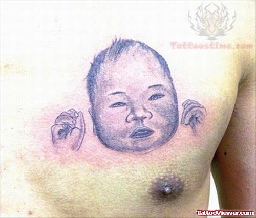 Baby Head Tattoo On Chest