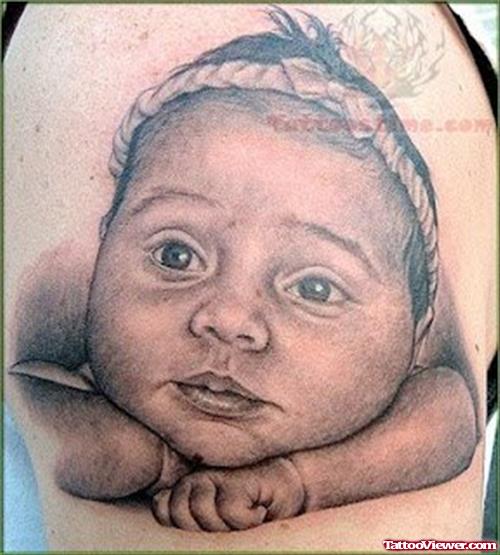 Baby Head Tattoo On Biceps