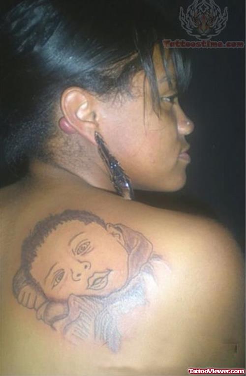 Baby Head Tattoo On Back Shoulder