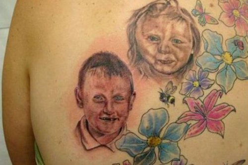 Colored Flowers With Baby Girl and Boy Head Tattoos On Back