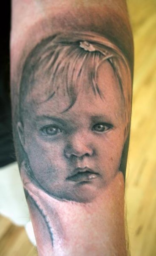 Grey Ink Realistic Baby Tattoo On Arm