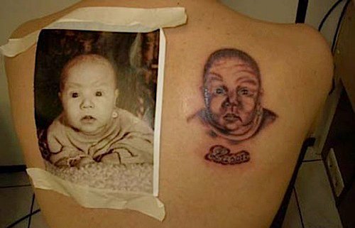 Baby Head Tattoo On Right Back Shoulder