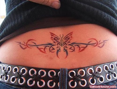 Red And Black Ink Tribal And Butterfly Lower Back Tattoo