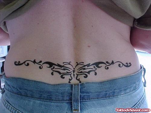 Black Ink Butterfly Lower Back Tattoo