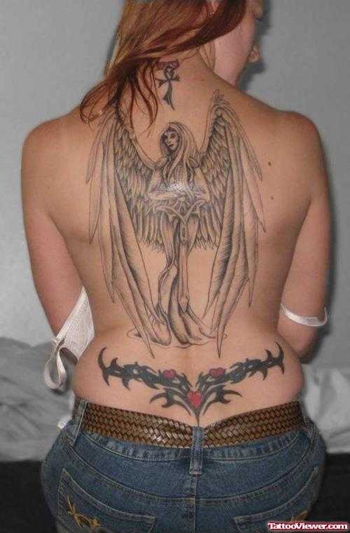 Grey Ink angel And Black Ink Tirbal With Flowers Back Tattoo For Girls