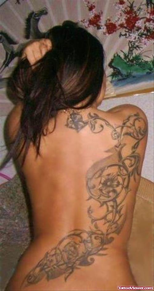 Grey Ink Tribal Back Tattoo For Girls