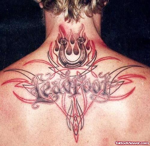 Upper Back Tribal And Flaming Horse Shoe Tattoo