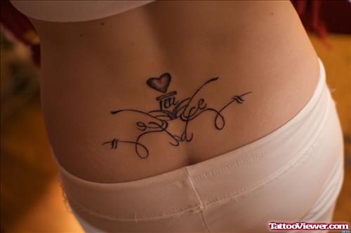 Tiny Heart And Tribal Lower Back Tattoo For Girls