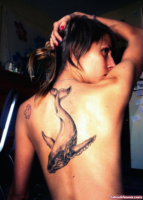 Grey Ink Whale Back Tattoo