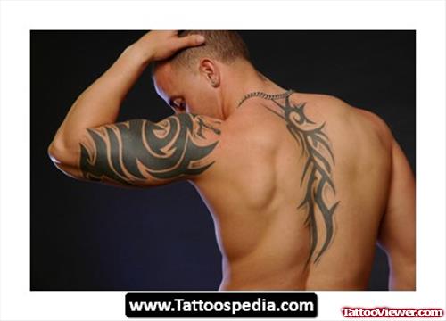 Tribal Back And Half Sleeve Tattoo